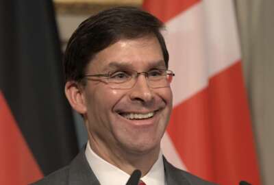 U.S. Secretary for Defense Mark Esper speaks during a press conference on the first day of the Munich Security Conference in Munich, Germany, Friday, Feb. 14, 2020. (AP Photo/Jens Meyer)b