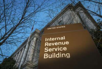 FILE - This April 13, 2014 file photo shows the headquarters of the Internal Revenue Service (IRS) in Washington. The agency said Wednesday, Feb. 19, 2020, that it is stepping up its efforts to visit high-income taxpayers who failed in prior years to file their tax returns on time. (AP Photo/J. David Ake, File)