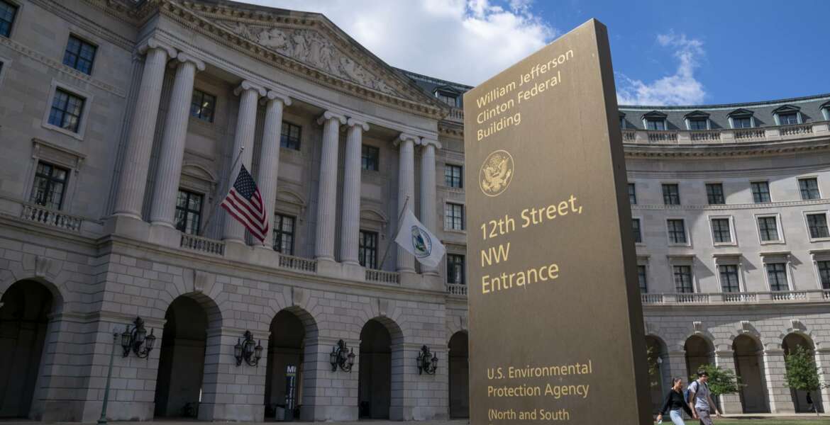 FILE - In this Spet. 18, 2019, file photo, the headquarters of the Environmental Protection Agency in Washington. A Trump administration proposal to roll back environmental reviews for big projects is drawing heavy objections from African American and Latino communities.  (AP Photo/J. Scott Applewhite)