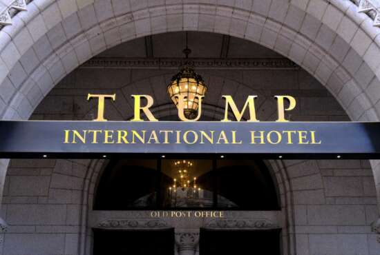 FILE- This March 11, 2019 file photo, shows the north entrance of the Trump International in Washington.  A federal appeals court in Washington on Friday dismissed a lawsuit filed by members of Congress that charged that President Donald Trump has illegally profited off the presidency.  (AP Photo/Mark Tenally, File)