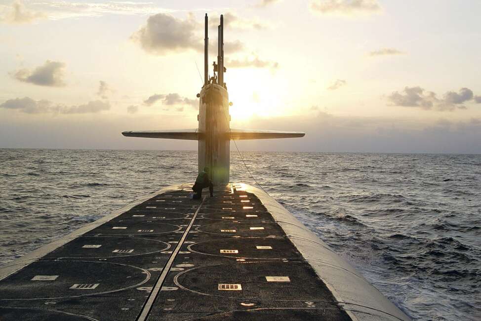 FILE - In this Jan. 9, 2008 photo released by the U.S. Navy, The Ohio-class ballistic-missile submarine USS Wyoming approaches Naval Submarine Base Kings Bay, Ga. The Pentagon's top policy official tells The Associated Press that the United States for the first time has deployed the newest addition to its nuclear arsenal — a submarine-launched weapon that the Trump administration says will make nuclear war less likely.  (Lt. Rebecca Rebarich/U.S. Navy via AP)