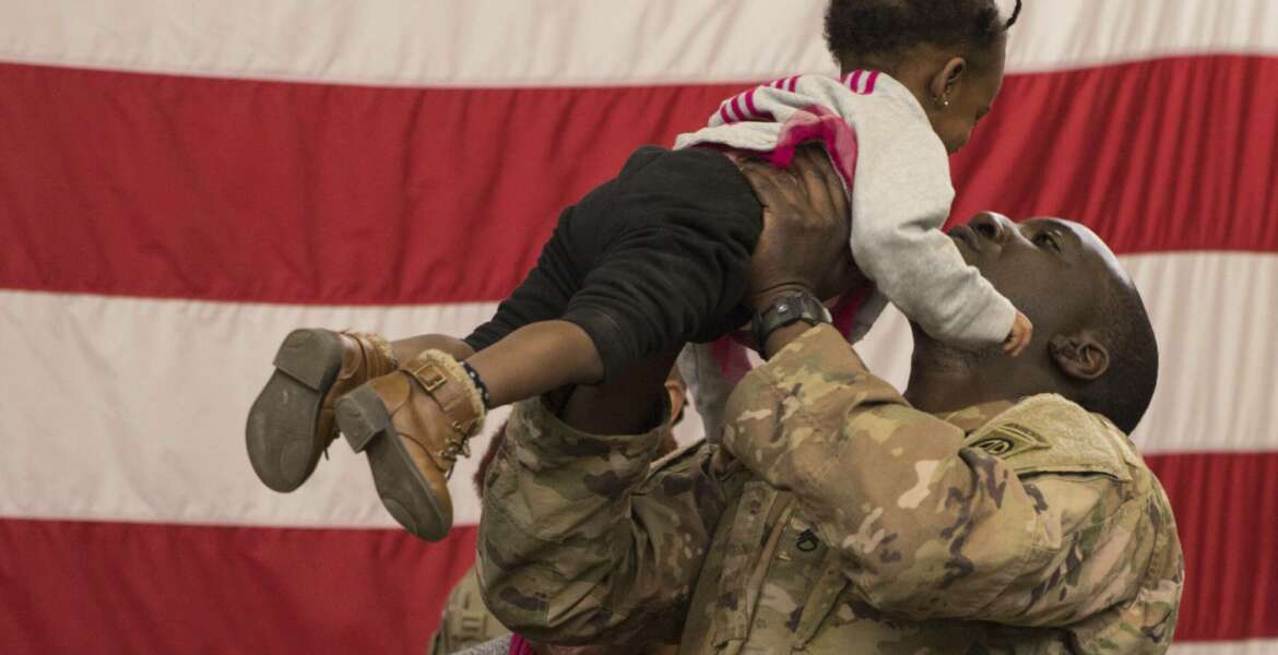 A soldier reunites with his daughter at Fort Bragg, N.C.  after returning from the Middle East. The 82nd Airborne Division's Immediate Response Force had been deployed since New Years Eve. Thursday, Feb. 20, 2020. Nearly two months after a U.S. Army rapid-response force was activated amid tensions with Iran, deploying 3,000 soldiers to the Middle East, some are returning home. By the end of the weekend, nearly 800 paratroopers from the 82nd Airborne Division’s Immediate Response Force are slated to have returned to Fort Bragg, North Carolina. On Thursday morning, eager family members waited in the base’s iconic Green Ramp to greet their loved ones. (U.S. Army via AP)