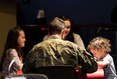 Senior Master Sgt. Paul Kalle, 723d Aircraft Maintenance Squadron first sergeant, speaks with a family during a Deployed Spouses Dinner Feb. 18, 2020, at Moody Air Force Base, Georgia. The monthly event is a free dinner at Georgia Pines Dining Facility designed as a ‘thank you’ for each families’ support and sacrifice while their spouse is deployed or on a remote assignment. The dinner, occurring on every third Tuesday of the month, provides an opportunity for spouses to interact with other families of deployed Airmen, key spouses and unit leadership, as well as provide a break for the spouse while military sponsor is deployed. The next Deployed Spouses Dinner will be March 17. (U.S. Air Force photo by Senior Airman Erick Requadt) 