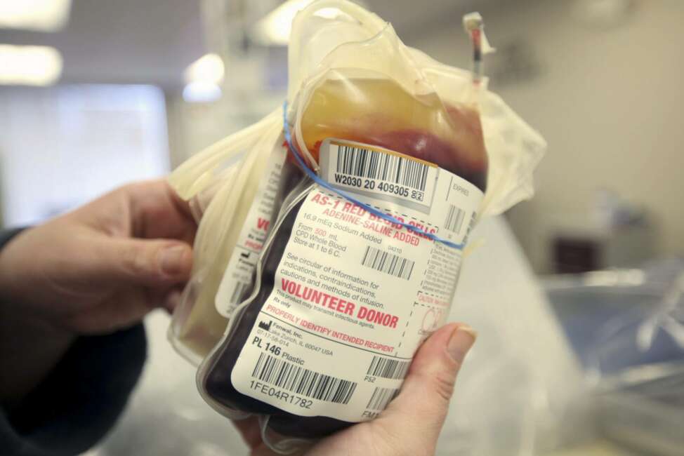 This Monday, March 9, 2020 file photo shows a packet of donated blood at The American Red Cross donation center in Scranton, Pa. On Friday, March 13, 2020, The Associated Press reported on stories circulating online incorrectly asserting that if you don’t have health insurance and can’t afford to take a $3,200 test for the COVID-19 coronavirus, donate blood because screeners must test donors for the virus. “We do a whole range of testing on blood donations as required by the FDA, but screening or testing for coronavirus is not happening,” said Kate Fry, chief executive officer of America’s Blood Centers, a North American network of nonprofit blood centers. (Jake Danna Stevens/The Times-Tribune via AP)