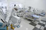 Staff inspect medical equipments at an emergency hospital set up amid the new coronavirus outbreak in Jakarta, Indonesia, Monday, March 23, 2020. Indonesia has changed towers built to house athletes in the 2018 Asian Games to emergency hospitals with a 3,000-bed capacity in the country's hard-hit capital, where new patients have surged in the past week. (Hafidz Mubarak A/Pool Photo via AP)