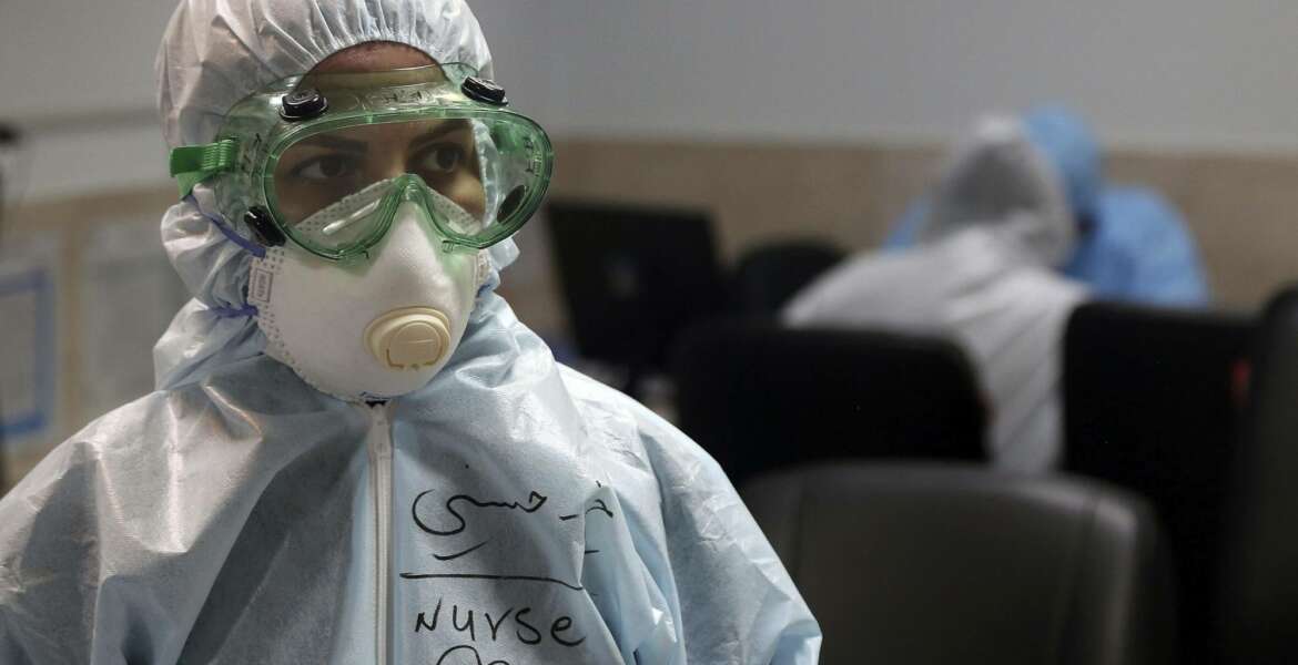 A nurse wears protective gear in a ward dedicated for people infected with the new coronavirus, at a hospital in Tehran, Iran, Sunday, March 8, 2020. With the approaching Persian New Year, known as Nowruz, officials kept up pressure on people not to travel and to stay home. Health Ministry spokesman Kianoush Jahanpour, who gave Iran's new casualty figures Sunday, reiterated that people should not even attend funerals. (AP Photo/Mohammad Ghadamali)