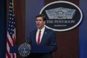 In this image provided by the Department of Defense, Defense Secretary Mark Esper speaks to members of the media during a news conference to discuss the department's efforts in response to the COVID-19 pandemic at the Pentagon Briefing Room in Washington, on Monday, March 23, 2020. (Army Staff Sgt. Nicole Mejia/Department of Defense via AP)