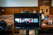 In this photo provided by the New York Unified Court System, a virtual arraignment is conducted at Criminal Court in New York, Wednesday, March 25, 2020. New York City's criminal court has started conducting all arraignments by video conferencing to limit traffic in courthouses during the coronavirus outbreak. (New York Unified Court System via AP)