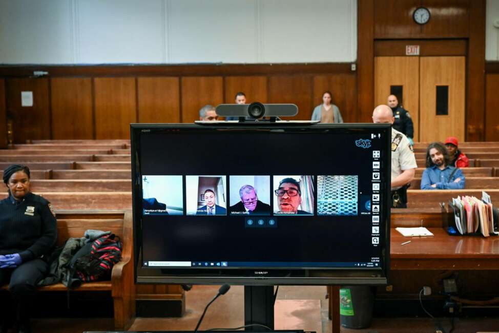 In this photo provided by the New York Unified Court System, a virtual arraignment is conducted at Criminal Court in New York, Wednesday, March 25, 2020. New York City's criminal court has started conducting all arraignments by video conferencing to limit traffic in courthouses during the coronavirus outbreak. (New York Unified Court System via AP)