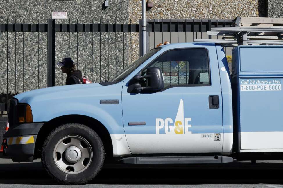 FILE - In this Feb. 18, 2020, file photo, a Pacific Gas &amp; Electric truck is parked in San Francisco. California regulators are being advised to approve PG&amp;E's plan for getting out of bankruptcy with new controls designed to prevent a recurrence of the utility's past bad behavior that has resulted in deadly wildfires, infuriating blackouts and high electricity rates. If approved, a proposed decision issued Monday, April 20, 2020, by Administrative Law Judge Peter Allen will enable PG&amp;E to clear another key hurdle in its frantic race to end one of the most complex bankruptcy cases in U.S. history by June 30. (AP Photo/Jeff Chiu, File)