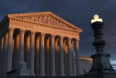 FILE - In this Jan. 24, 2019 file photo, the Supreme Court is seen at sunset in Washington. The Supreme Court has ruled that insurance companies can collect $12 billion from the federal government to cover their losses in the early years of the health care law championed by President Barack Obama. The justices voted 8-1 Monday in holding that insurers are entitled to the money under a provision of the “Obamacare” health law that promised the companies a financial cushion for losses they might incur by selling coverage to people in the marketplaces created by the health care law. (AP Photo/J. Scott Applewhite)