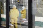 FILE - In this Thursday, April 2, 2020, file photo, workers in hazardous material suits clean inside the Abigail Hotel in San Francisco. The hotel is one of several private hotels San Francisco has contracted with to take vulnerable people who show symptoms or are awaiting test results for the coronavirus. Gov. Gavin Newsom, who made solving the state's homelessness crisis a priority even before the pandemic struck, announced in mid-March his administration was negotiating with 900 hotels to house the homeless. Two weeks ago he announced Project Roomkey, a program in which the Federal Emergency Management Agency will pay 75% of costs associated with housing some homeless, including people who test positive or may have been exposed to the virus, and older homeless people and those with underlying health conditions. (AP Photo/Jeff Chiu, File)