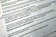 Shown is a portion of a Small Business Administration Paycheck Protection Program Borrower Application Form, Tuesday, April 21, 2020 in Washington. The Paycheck Protection was supposed to be a lifeline for small businesses, helping them stay afloat and keep their employees on the payroll during the coronavirus pandemic. But guidelines from the Small Business Administration say that businesses are ineligible if someone who owns at least 20 percent of the company is incarcerated, under indictment, on probation or parole or had been convicted of a felony within the last five years. Ineligible would-be applicants and advocates say the restrictions are a slap in the face for those who have served their time, especially from an administration that has trumpeted second chances. (AP Photo/Wayne Partlow)