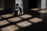 A custodian walks in the Hart Senate Office Building on Capitol Hill in Washington, Tuesday, May 12, 2020. Senate office buildings and the U.S. Capitol remain closed to the public in response to the coronavirus outbreak. (AP Photo/Patrick Semansky)