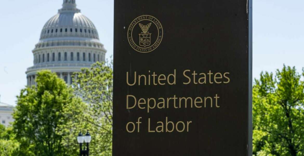 In this May 7, 2020, photo, the entrance to the Labor Department is seen near the Capitol in Washington. The record unemployment rate reflects a nation ravaged by the coronavirus pandemic, the economic devastation upending the presidential campaign and forcing President Donald Trump to overcome historic headwinds to win a second term.  (AP Photo/J. Scott Applewhite)