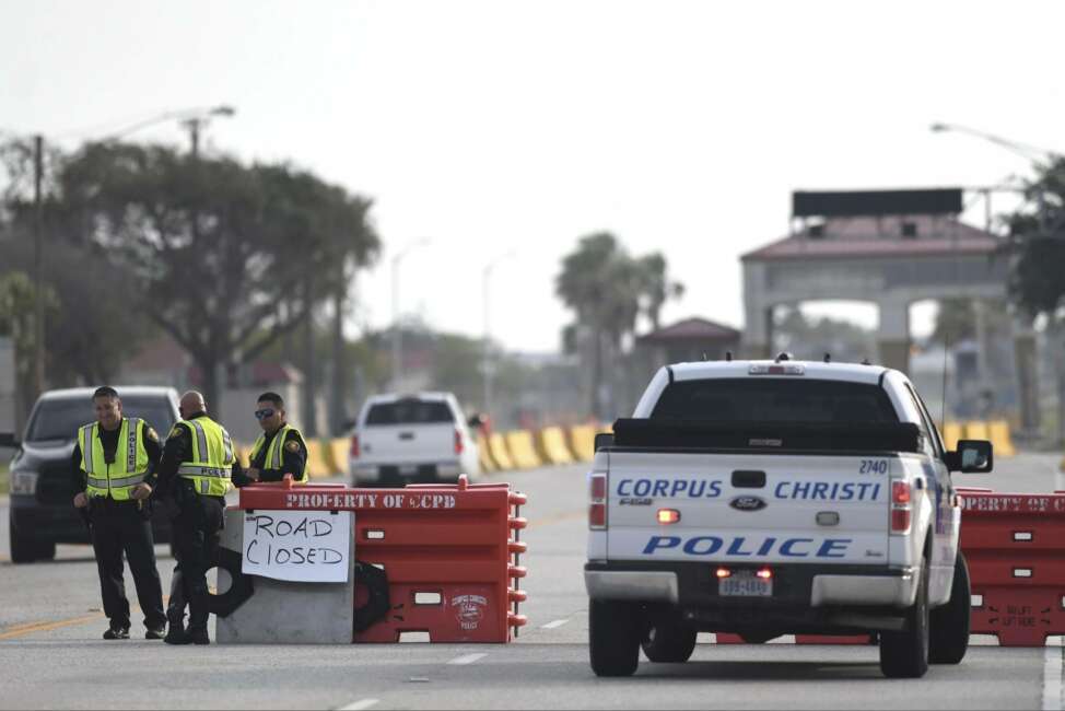 The entrances to the Naval Air Station-Corpus Christi are closed following an active shooter threat, Thursday, May 21, 2020, in Corpus Christi, Texas. Naval Air Station-Corpus Christi says the shooter was "neutralized" and the facility is on lockdown.  (Annie Rice/Corpus Christi Caller-Times via AP)