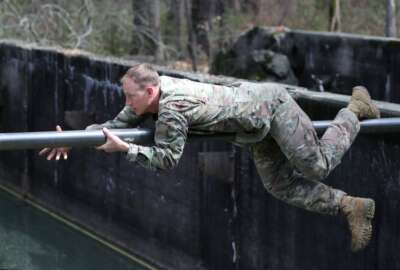  A student assigned to the U.S. Army John F. Kennedy Special Warfare Center and School maneuvers across an obstacle during the evasion phase of Survival Evasion Resistance and Escape Level-C training (SERE) at Camp Mackall, North Carolina, March 21, 2020. Soldiers in SERE underwent intensive training in support of the Code of the Conduct, and were taught survival fieldcraft skills, techniques of evasion, resistance to exploitation and resolution skills along with critical life saving techniques for austere conditions that are key to survival and the ability to return with honor.