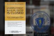 A sign announces the closure of the Massachusetts Unemployment Office, Saturday, May 9, 2020, in Boston. (AP Photo/Michael Dwyer)