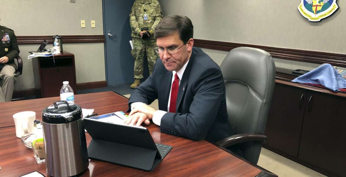 Defense Secretary Mark Esper speaks by video teleconference from U.S. Northern Command in Colorado Springs, Colo., on Thursday, May 7, 2020, with military medical specialists at civilian hospitals in New York and Connecticut. (AP Photo/Robert Burns)