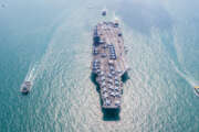 Navy Nuclear Aircraft carrier, Military navy ship carrier full loading fighter jet aircraft, Aerial view.