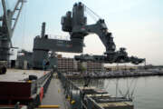 The Office of Naval Research tests their Large Vessel Interface Lift-on/Lift-off crane at Naval Station Norfolk. The demonstrator crane, which has been temporarily installed on the Maritime Administration ship SS Flickertail State, uses motion-sensing technology to control standard 20-foot containers in all six degrees of freedom. 