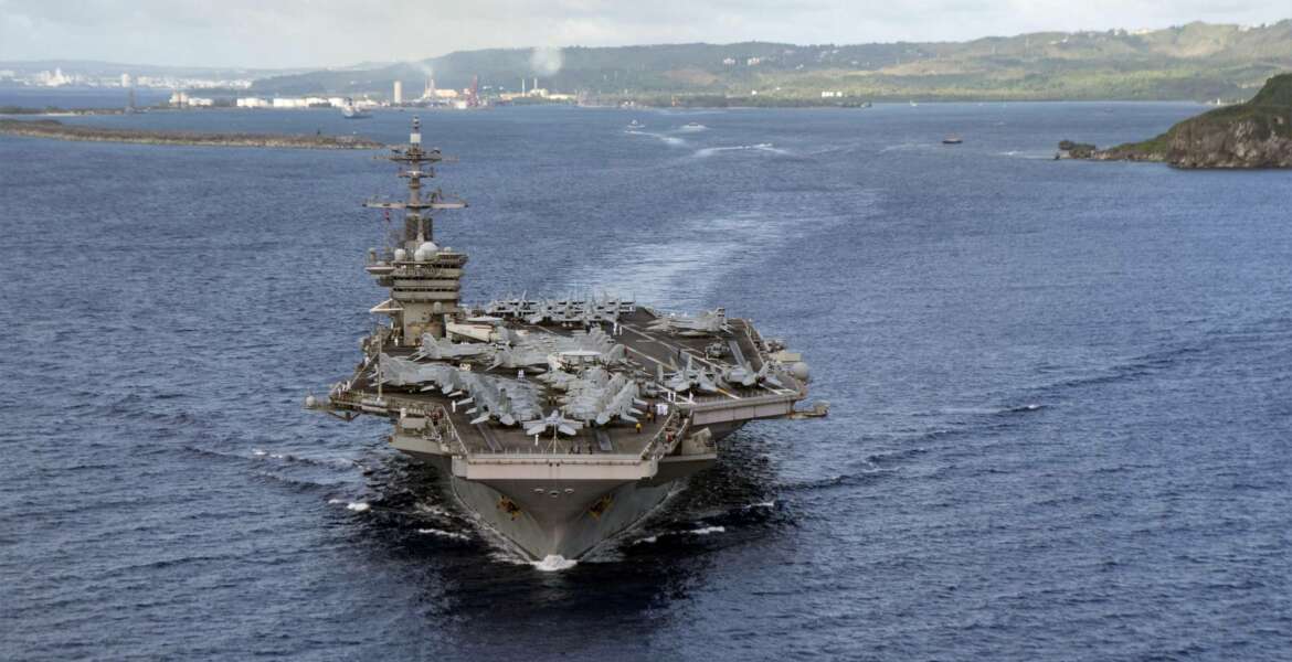 PHILIPPINE SEA (June 4, 2020) In this June 4, 2020, photo provided by the U.S. Navy, the aircraft carrier USS Theodore Roosevelt (CVN 71) departs Apra Harbor in Guam. The carrier has returned to sea and is conducting military operations in the Pacific region, 10 weeks after a massive coronavirus outbreak sidelined Navy warship. (Mass Communication Specialist Seaman Kaylianna Genier/U.S. Navy via AP)
