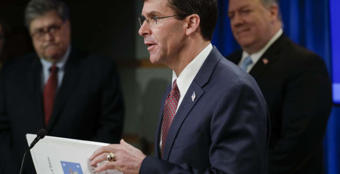 Secretary of Defense Mark Esper speaks as Attorney General William Barr, left and Secretary of State Mike Pompeo look on, during a joint briefing, Thursday, June 11, 2020 at the State Department in Washington, on an executive order signed by President Donald Trump aimed at the International Criminal Court. Trump has lobbed a broadside attack against the International Criminal Court. He's authorizing economic sanctions and travel restrictions against court workers directly involved in investigating American troops and intelligence officials for possible war crimes in Afghanistan without U.S. consent. The executive order Trump signed on Thursday marks his administration’s latest attack against international organizations, treaties and agreements that do not hew to its policies.  (Yuri Gripas/Pool via AP)