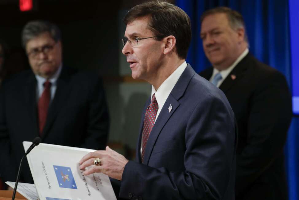 Secretary of Defense Mark Esper speaks as Attorney General William Barr, left and Secretary of State Mike Pompeo look on, during a joint briefing, Thursday, June 11, 2020 at the State Department in Washington, on an executive order signed by President Donald Trump aimed at the International Criminal Court. Trump has lobbed a broadside attack against the International Criminal Court. He's authorizing economic sanctions and travel restrictions against court workers directly involved in investigating American troops and intelligence officials for possible war crimes in Afghanistan without U.S. consent. The executive order Trump signed on Thursday marks his administration’s latest attack against international organizations, treaties and agreements that do not hew to its policies.  (Yuri Gripas/Pool via AP)