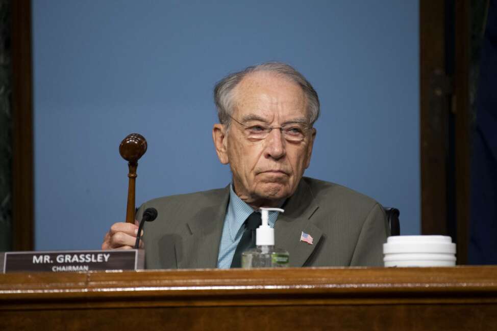 Chairman Chuck Grassley, R-Iowa, holds up a gavel during a Senate Finance Committee hearing on "COVID-19/Unemployment Insurance" on Capitol Hill in Washington on Tuesday, June 9, 2020. (Caroline Brehman/CQ Roll Call/Pool via AP)