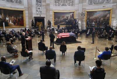 Senate Majority Leader Mitch McConnell of Ky., speaks during a memorial service as the flag-draped casket of Rep. John Lewis, D-Ga., lies in state at the Capitol Rotunda, Monday, July 27, 2020, in Washington.  (Shawn Thew/Pool via AP)
