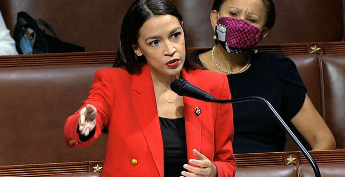 In this image from video, Rep. Alexandria Ocasio-Cortez, D-N.Y., speaks on the House floor, Thursday, July 23, 2020 on Capitol Hill in Washington.   Ocasio-Cortez's objections to a Republican lawmaker's verbal assault on her expanded Thursday as she and other Democrats took to the House floor to demand an end to a sexist culture of “accepting violence and violent language against women.”  Rep. Nydia Velázquez, D-N.Y., is seated right. (House Television via AP)