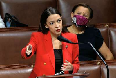 In this image from video, Rep. Alexandria Ocasio-Cortez, D-N.Y., speaks on the House floor, Thursday, July 23, 2020 on Capitol Hill in Washington.   Ocasio-Cortez's objections to a Republican lawmaker's verbal assault on her expanded Thursday as she and other Democrats took to the House floor to demand an end to a sexist culture of “accepting violence and violent language against women.”  Rep. Nydia Velázquez, D-N.Y., is seated right. (House Television via AP)