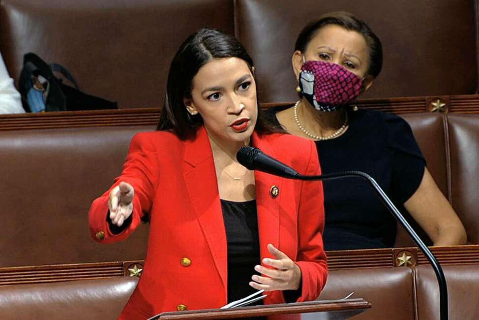 In this image from video, Rep. Alexandria Ocasio-Cortez, D-N.Y., speaks on the House floor, Thursday, July 23, 2020 on Capitol Hill in Washington.   Ocasio-Cortez's objections to a Republican lawmaker's verbal assault on her expanded Thursday as she and other Democrats took to the House floor to demand an end to a sexist culture of “accepting violence and violent language against women.”  Rep. Nydia Velázquez, D-N.Y., is seated right. (House Television via AP)