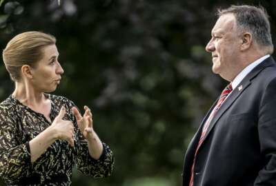 FILE - In this July 22, 2020 file photo Secretary of State Mike Pompeo, right, speaks with Danish Prime Minister Mette Frederiksen in the garden of Marienborg Castle north of Copenhagen. The Trump administration has appointed a new special envoy for the Arctic. The appointment of career diplomat Jim DeHart to the job of U.S. coordinator for the Arctic fills a post that was vacant for more than three years as the administration seeks a greater role in the region and tries to blunt growing Russian and Chinese influence there. The State Department announced the move Wednesday, a week after Secretary of State Mike Pompeo vowed enhanced U.S. engagement in the Arctic on a visit to Denmark. (Mads Claus Rasmussen/Pool Photo via AP)