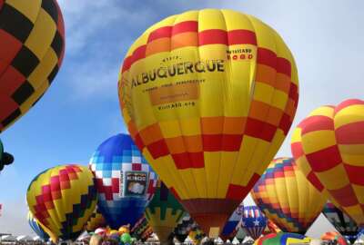 FILE - Hot air balloons are inflated during the annual Albuquerque International Balloon Fiesta in Albuquerque, N.M., on Saturday, Oct. 5, 2019. The Santa Fe Opera, Meow Wolf and the non-profit organization that puts on the Albuquerque International Balloon Fiesta are among the New Mexico businesses that received loans from the federal government as part of massive effort to support the economy amid the coronavirus outbreak. (AP Photo/Susan Montoya Bryan, file)