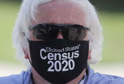 Amid concerns of the spread of COVID-19, census worker Ken Leonard wears a mask as he mans a U.S. Census walk-up counting site set up for Hunt County in Greenville, Texas, Friday, July 31, 2020. (AP Photo/LM Otero)