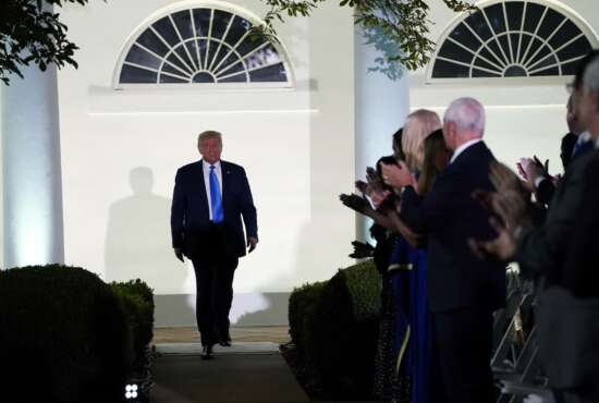 President Donald Trump arrives to listen to first lady Melania Trump speak during the 2020 Republican National Convention from the Rose Garden of the White House, Tuesday, Aug. 25, 2020, in Washington. (AP Photo/Evan Vucci)