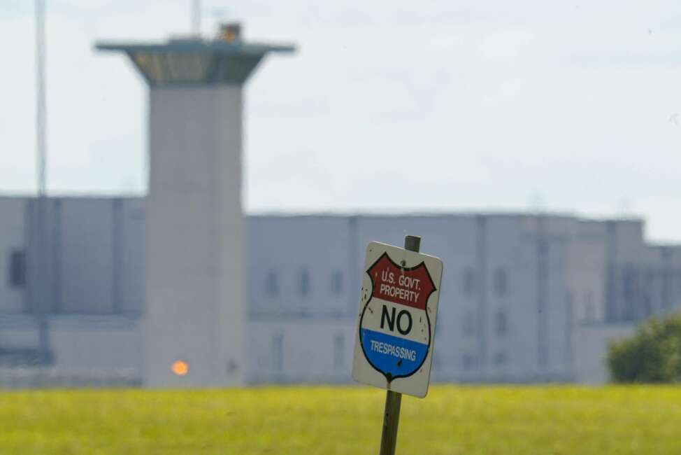 FILE - In this Aug. 26, 2020, file photo, the federal prison complex in Terre Haute, Ind. The federal Bureau of Prisons will begin allowing inmates to have visitors again in October, months after visits were suspended at the 122 federal prisons across the U.S. The visitation plan is detailed in an internal memo issued Monday, Aug. 31, and obtained by The Associated Press. (AP Photo/Michael Conroy, File)