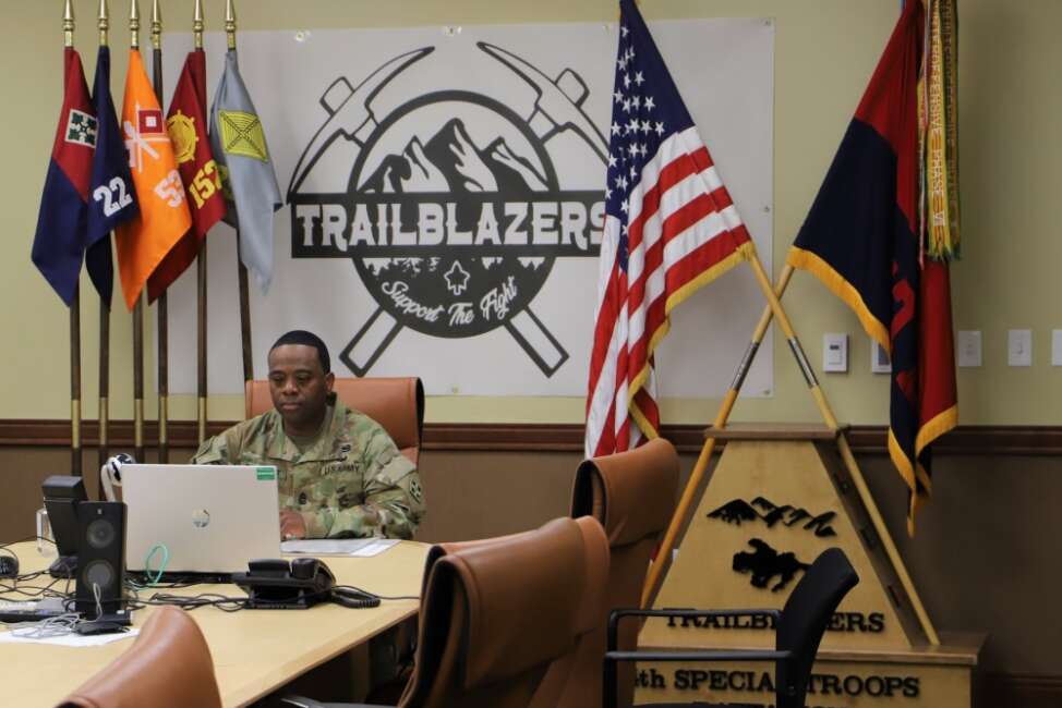 Command Sgt. Maj. Johnny Bryant, battalion sergeant major and president of the board, 4th Special Troops Battalion, 4th Sustainment Brigade, 4th Infantry Division listens to a Soldier’s response during 4STB’s virtual promotion board 29 April at the brigade headquarters building on Fort Carson, Colorado. The board members communicated with the Soldiers and their sponsors through video teleconference. (U.S. Army photo by Sgt. James Geelen, 4th Sustainment Brigade Public Affairs Office, 4th Infantry Division)

