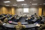 In this image provided by the U.S. Air force Academy, academy cadets start the school year with a mix of reduced class sizes and remote learning on Aug. 12, 2020, at the U.S. Air Force Academy in Colorado Springs, Colo. Under the siege of the coronavirus pandemic, classes have begun at the Naval Academy, the Air Force Academy and the U.S. Military Academy at West Point. But unlike at many colleges around the country, most students are on campus and many will attend classes in person. (Trevor Cokley/U.S. Air Force Academy via AP)