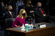 Supreme Court nominee Amy Coney Barrett arrives for her Senate Judiciary Committee confirmation hearing on Capitol Hill in Washington, Monday, Oct. 12, 2020. (Caroline Brehman/Pool via AP)