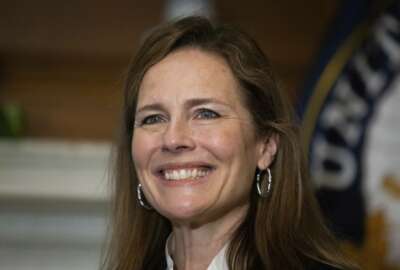 In this Oct. 1, 2020, photo, Supreme Court nominee Judge Amy Coney Barrett, meets with Sen. Roger Wicker, R-Miss., at the Capitol in Washington. Confirmation hearings begin Monday for President Donald Trump’s Supreme Court nominee, Amy Coney Barrett. If confirmed, the 48-year-old appeals court judge would fill the seat of liberal Justice Ruth Bader Ginsburg, who died last month.  (Graeme Jennings/Pool via AP)