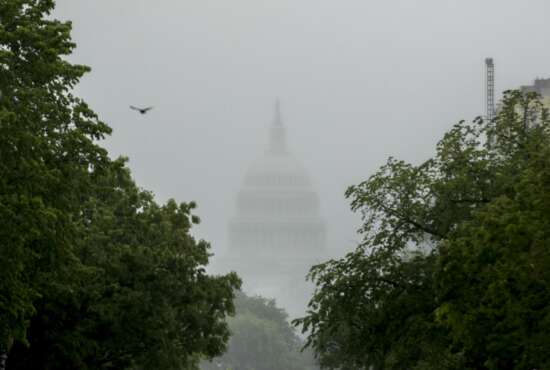 FILE - In this May 22, 2020, file photo the Dome of the U.S. Capitol Building is visible through heavy fog in Washington. New virus relief will have to wait until after the November election. Congress is past the point at which it can deliver more coronavirus aid soon, with differences between House Speaker Nancy Pelosi, Senate Republicans and President Donald Trump proving insurmountable. (AP Photo/Andrew Harnik, File)