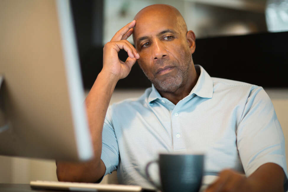 African American man dealing with depression and sad.