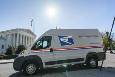 A U.S. Postal Service truck makes deliveries next to the Supreme Court on Election Day, Tuesday, Nov. 3, 2020, in Washington. President Donald Trump says he's planning an aggressive legal strategy to try prevent Pennsylvania from counting mailed ballots that are received in the three days after the election, a matter that could find its way to the high court. (AP Photo/J. Scott Applewhite)