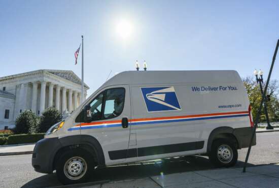 A U.S. Postal Service truck makes deliveries next to the Supreme Court on Election Day, Tuesday, Nov. 3, 2020, in Washington. President Donald Trump says he's planning an aggressive legal strategy to try prevent Pennsylvania from counting mailed ballots that are received in the three days after the election, a matter that could find its way to the high court. (AP Photo/J. Scott Applewhite)