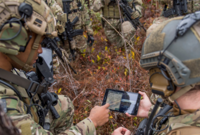 Members of the 6th Special Operations Squadron use a tablet to upload coordinates during an exercise showcasing the capabilities of the Advanced Battle Management System at Duke Field, Fla., Dec. 17, 2019. During the first demonstration of the ABMS, operators across the Air Force, Army, Navy and industry tested multiple real-time data sharing tools and technology in a homeland defense-based scenario enacted by U.S. Northern Command and enabled by Air Force senior leaders. The collection of networked systems and immediately available information is critical to enabling joint service operations across all domains. (U.S. Air Force photo by Tech. Sgt. Joshua J. Garcia)

