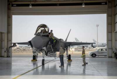 In this Aug. 5, 2019, photo released by the U.S. Air Force, an F-35 fighter jet pilot and crew prepare for a mission at Al-Dhafra Air Base in the United Arab Emirates. The Trump administration has formally notified Congress that it plans to sell 50 advanced F-35 fighter jets to the United Arab Emirates as part of a broader arms deal worth more than $23 billion. (Staff Sgt. Chris Thornbury/U.S. Air Force via AP)