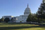 Sunlight shines on the lawn in front of the Capitol as workers build the stage, bleachers and tower for TV cameras for the presidential inaugural Saturday, Nov. 7, 2020, in Washington. In the midst of a pandemic and at the end of a hotly contested election campaign, the work goes on. (AP Photo/Mark Sherman)