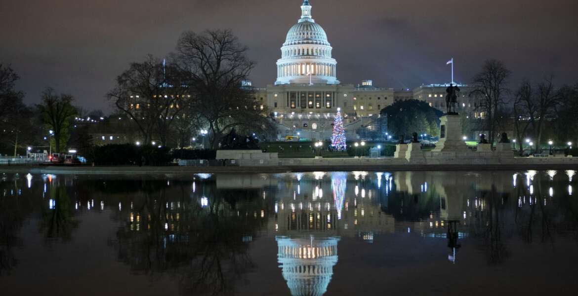 The U.S. Capitol is seen at night after negotiators sealed a deal for COVID relief, Sunday, Dec. 20, 2020, in Washington. Top Capitol Hill negotiators sealed a deal Sunday on an almost $1 trillion COVID-19 economic relief package, finally delivering long-overdue help to businesses and individuals and providing money to deliver vaccines to a nation eager for them. (AP Photo/Jose Luis Magana.